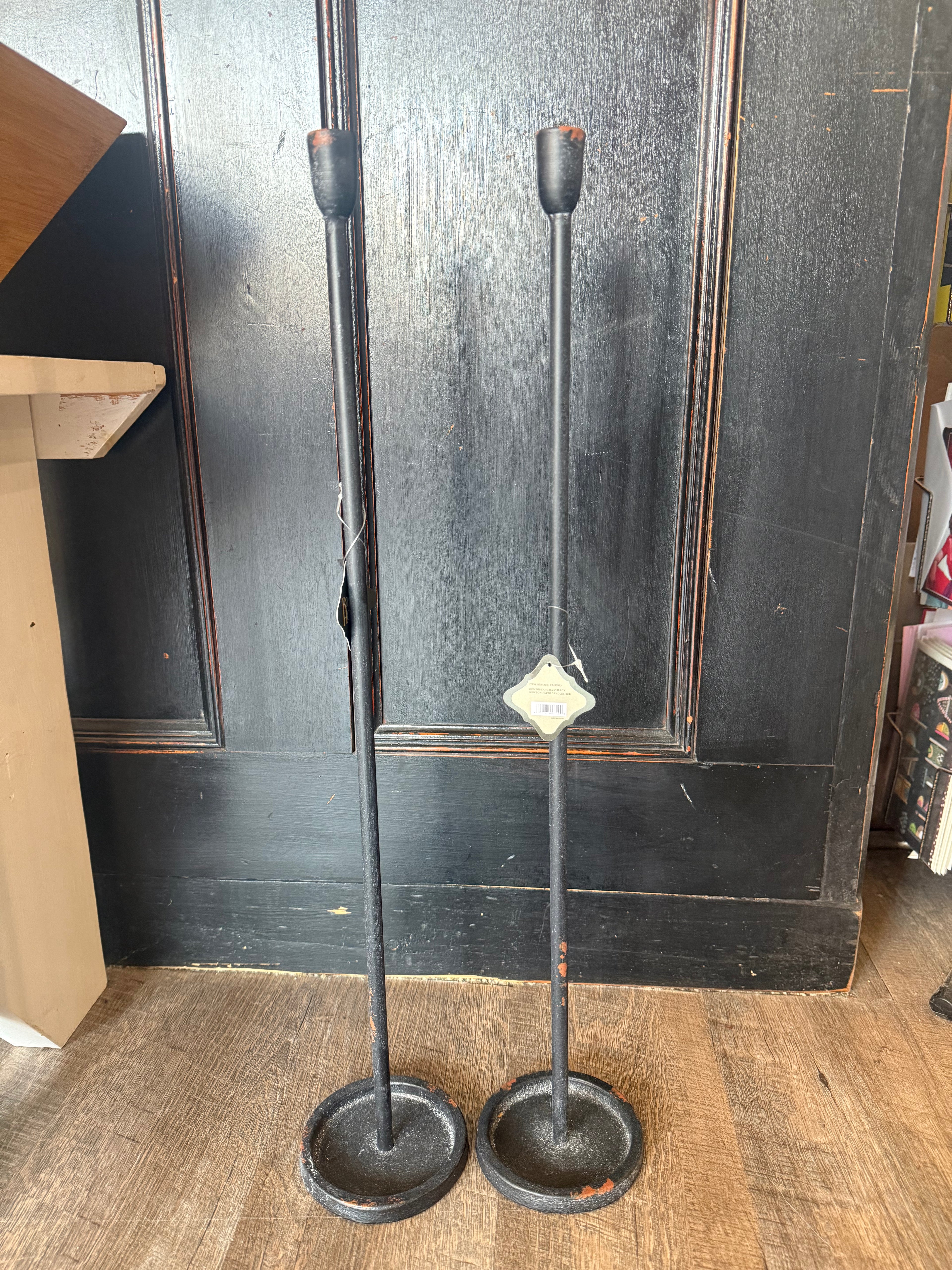 Black Newton taper candlesticks